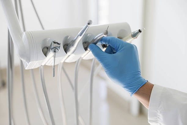 Professional Tooth Extraction technician working in Lexington, IL